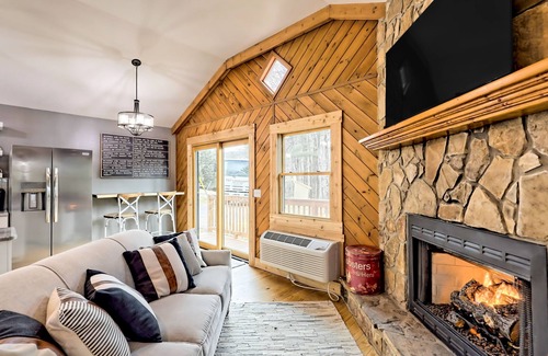 Blairsville Cabin | The Coop | Woodland cabin in Blairsville with wraparound porch & fireplace