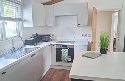 Langworth Ski Chalet | The Country oak is a 2 double bedroom lodge with en suites to both rooms.