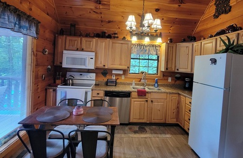 Sevierville Cabin | The Cozy Cub is a cozy 2-bedroom secluded cabin in charming Sevierville