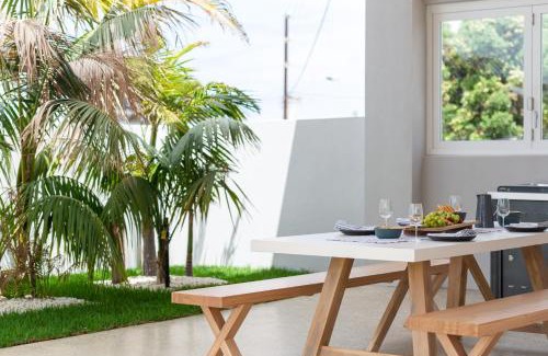 Christies Beach Apartment | The Elements l Fire l 4 Stunning Apartments each with Private Outdoor Dining l Walk to the Beach l Family Friendly l Wifi l Netflix l Outdoor Shower l Communal BBQ Pavilion and Lawn Area l