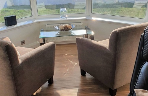 Tywyn House | The Gables is a large bungalow on the sea front with great sea views and sunsets