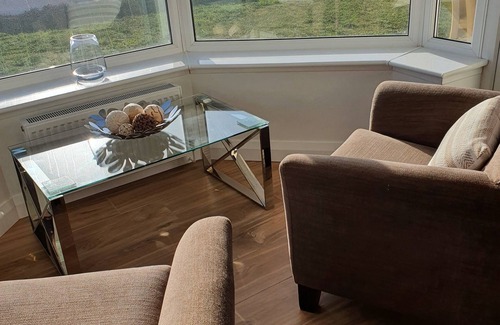 Tywyn House | The Gables is a large bungalow on the sea front with great sea views and sunsets