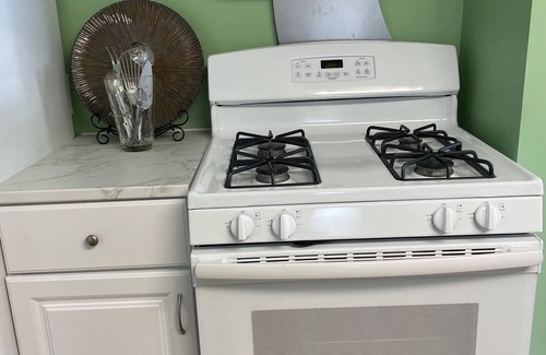 Winchester Apartment | The Inn at Highland Lake, 2nd Floor, waterfront yard with a boat dock