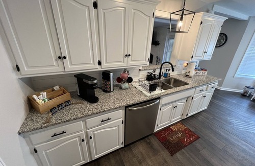 Fort Smith House | The Lily Pad. 3 bd/1ba. 4 beds. Center of town! Fenced backyard!