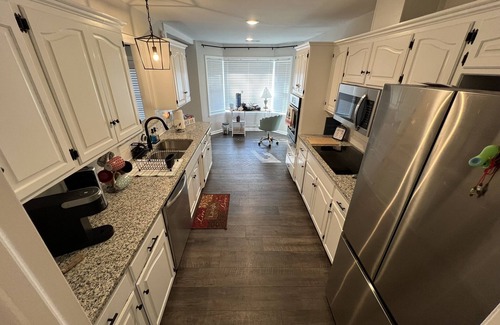 Fort Smith House | The Lily Pad. 3 bd/1ba. 4 beds. Center of town! Fenced backyard!