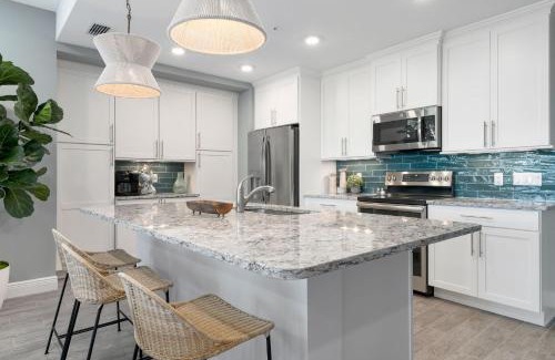 Whitney Beach House | The Oasis at One Particular Harbor! Modern tropical condo in Margaritaville!