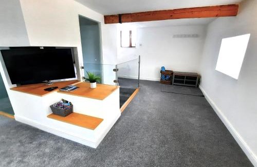 Camborne Apartment | The Penthouse, top floor of a Grade II Listed Mill