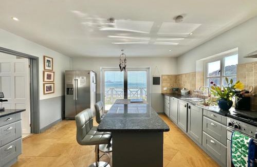Pembroke Villa | The Sandcastle. Private steps onto a sandy beach