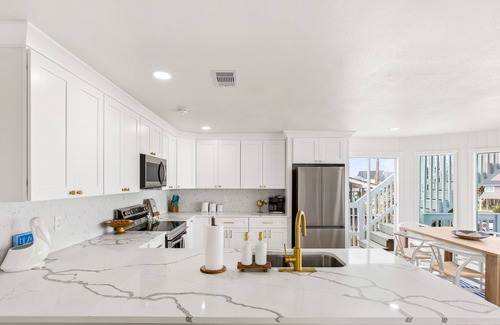 Spanish Grant House | The Sandy Pelican - Steps from the Ocean, Pet Friendly, and No Cleaning Fee!
