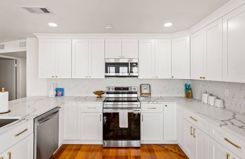 Spanish Grant House | The Sandy Pelican - Steps from the Ocean, Pet Friendly, and No Cleaning Fee!