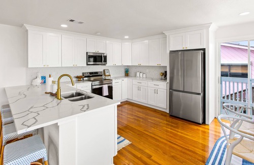 Spanish Grant House | The Sandy Pelican - Steps from the Ocean, Pet Friendly, and No Cleaning Fee!