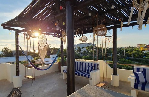 Isla Mujeres Apartment | The Sol Studio Suite with balcony overlooking the pool and garden area