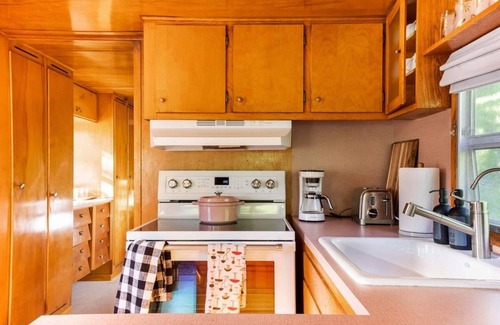 Arroyo Grande Apartment | The Spartan is a fun 1950's vintage trailer under oak trees overlooking a 1 acre organic farm!