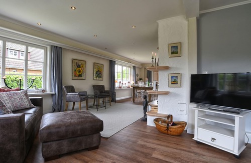 Nieblum House | The thatched-roof vacation home has 3 bedrooms and 2 bathrooms, and offers a large living area.
