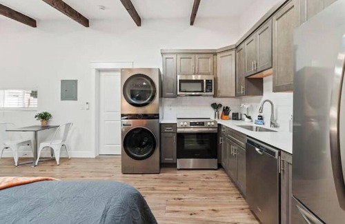South Salt Lake Apartment | The Ultimate SLC Studio - Fireplace - Hot Tub - Firepits-Shared Backyard+Parking