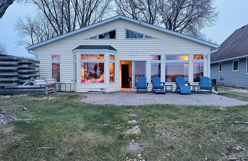 Spirit Lake House | The Yellow House on East Lake! Dock access to bring your boat.