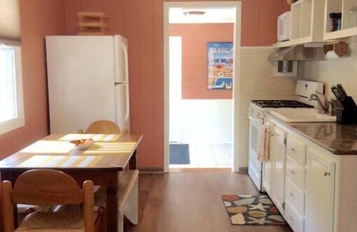 Michigan City Cottage | The Yellow House Near the ShorenWalking distance to Sheridan Beach,