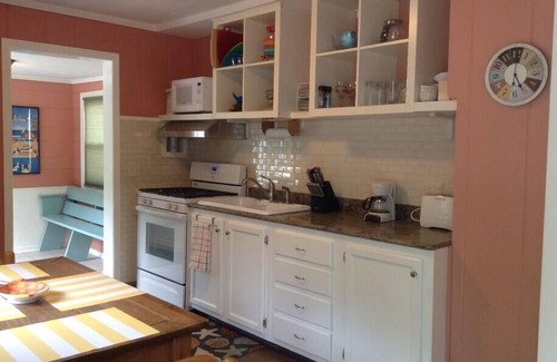 Michigan City Cottage | The Yellow House Near the ShorenWalking distance to Sheridan Beach,
