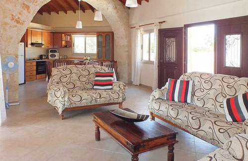 Pomos House | This attractive stone villa is set in an elevated position and commands wonderful views out across t