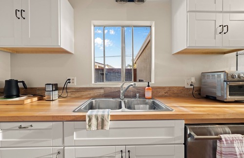 Ventura House | This charming two-bedroom, one-bath duplex is your ideal coastal retreat, offering an authentic beach town experience just a short distance from the water.