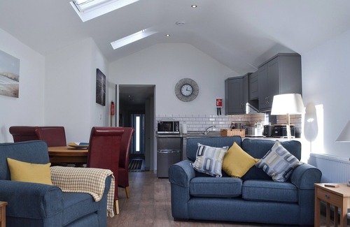 Treator Cottage | This ground floor apartment benefits from it’s own private decked area.