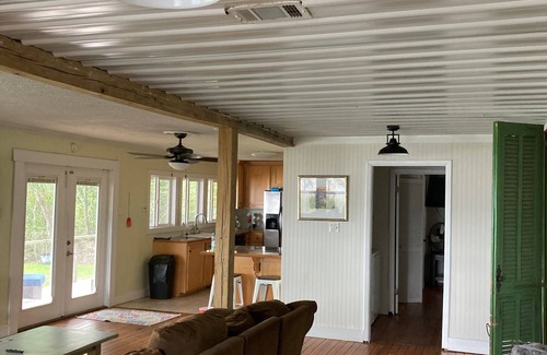 Fairhope Cottage | This inviting outdoor living space is an extension of the home,