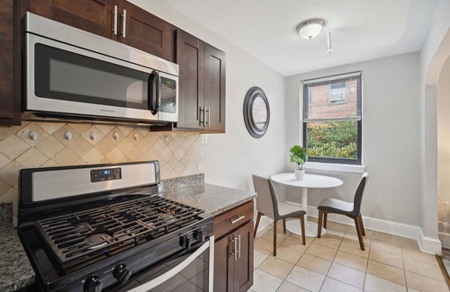 Germantown Apartment | This is a studio apartment with a separate kitchen nook, and a small living nook with a loveseat