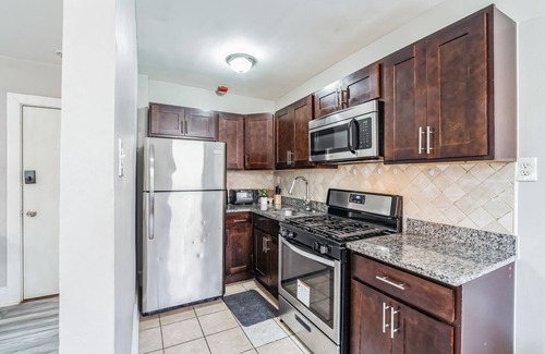 Germantown Apartment | This is a studio apartment with a separate kitchen nook, and a small living nook with a loveseat