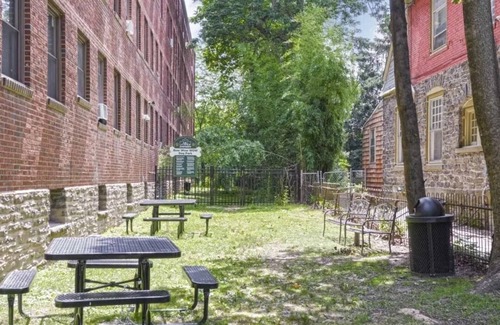 Germantown Apartment | This is a studio apartment with a separate kitchen nook, and a small living nook with a loveseat