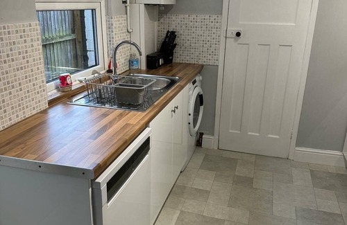 Gloucester House | This three bedroom house features zip and link beds, one bathroom and a fully equipped kitchen.