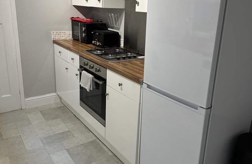 Gloucester House | This three bedroom house features zip and link beds, one bathroom and a fully equipped kitchen.