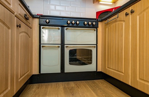 Carnforth Ski Chalet | This traditional two bedroom holiday home one row back from the lake, boasts partial lake views.