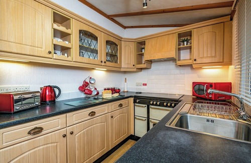 Carnforth Ski Chalet | This traditional two bedroom holiday home one row back from the lake, boasts partial lake views.