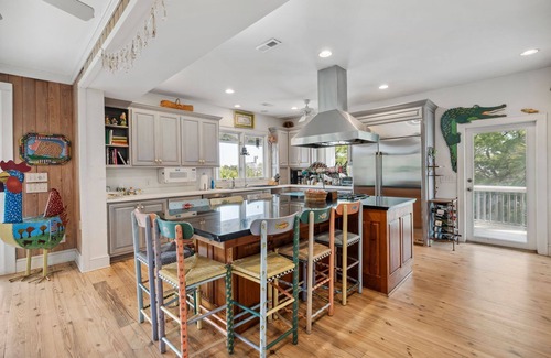 Debordieu Colony House | This vibrant family home features 8 bedrooms, and 8 bathrooms, ocean and creek views