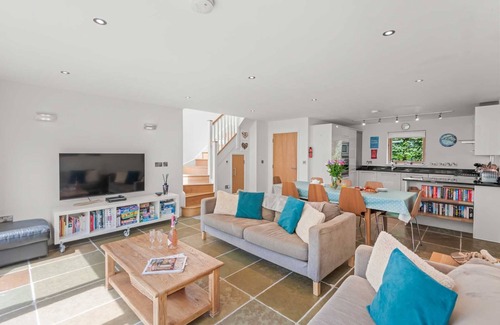 Talland House | This wonderfully light open-design, pet friendly house overlooks the charming natural pool and is cl