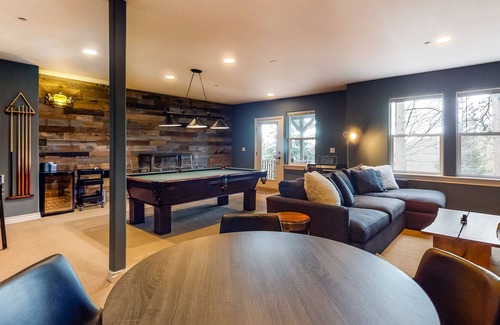 Blue Jay House | Three-story home with fireplace, central AC, game room & lake view dog-friendly