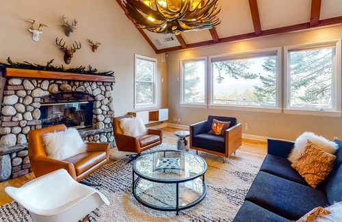 Blue Jay House | Three-story home with fireplace, central AC, game room & lake view dog-friendly