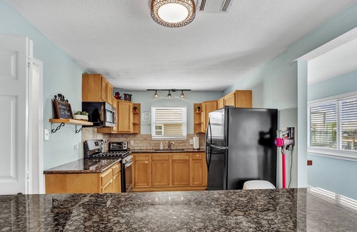 Bayou Vista House | Tiffany Blue Canal Home with Ocean Breeze