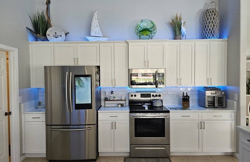 Edgewater House | Tiki Hut on Canal w/Gulf Access, Heated Pool Lanai 12 min. to PGD Airport