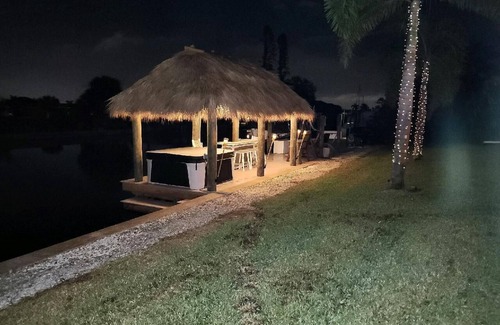 Edgewater House | Tiki Hut on Canal w/Gulf Access, Heated Pool Lanai 12 min. to PGD Airport