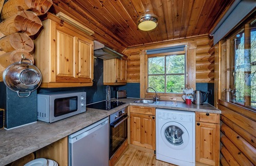 Westleigh Ski Chalet | Timber lodge set in an elevated position with views of the lake.