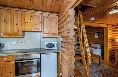 Westleigh Ski Chalet | Timber lodge set in an elevated position with views of the lake.