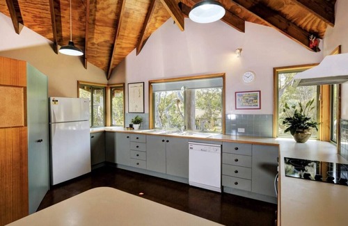 Boomerang Beach House | Timeless house with heated spa pool, walk to beaches.