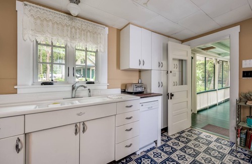 Melvin Village House | Timeless lakefront home on Lake Winnipesaukee with screened-in porch and dock