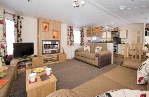 Burnham-on-Sea House | Top of the range 12ft-wide caravan with one double and two twin.
