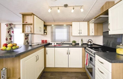 Burnham-on-Sea House | Top of the range 12ft-wide caravan with one double and two twin.
