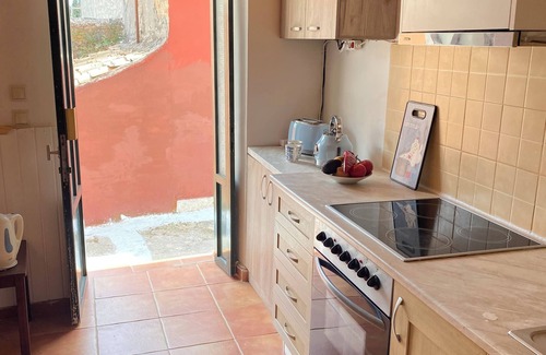Karousades Cottage | Traditional Cottage and Garden Studio with Balcony, Terrace and Views to the Sea