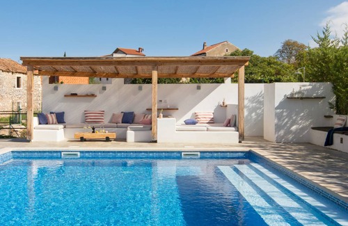 Cepljani House | Traditional stone house in a modern style with a pool and a generous garden