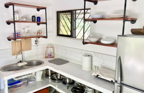 Puerto Carrillo House | Tranquil retreat on coastal route. By sand, surf, river, & jungle. Perfect vibe.