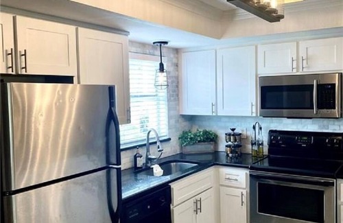 Capri Isle House | Treasure Island St Pete Beach FL 2BR 4BA Walk to Beach 3 level Garage Townhouse
